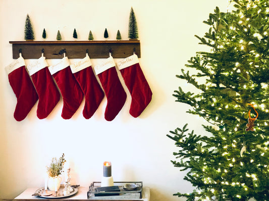 Stockings hanging next to Christmas tree