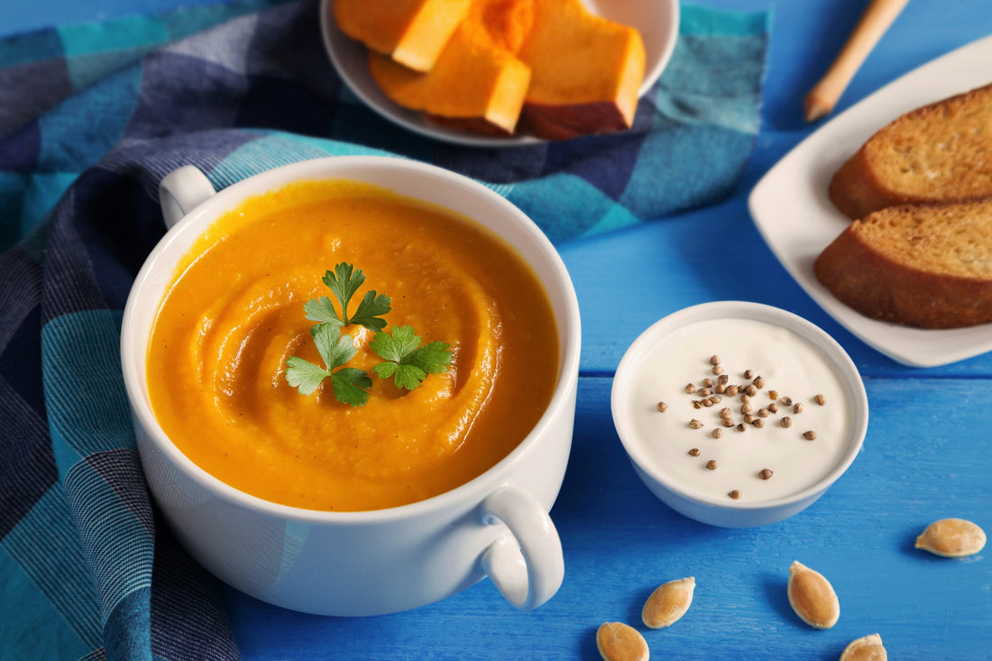 Winter soup and pastries on a blue background