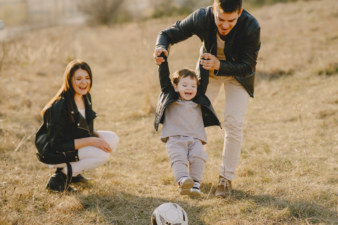 Family having fun with a soccer ball