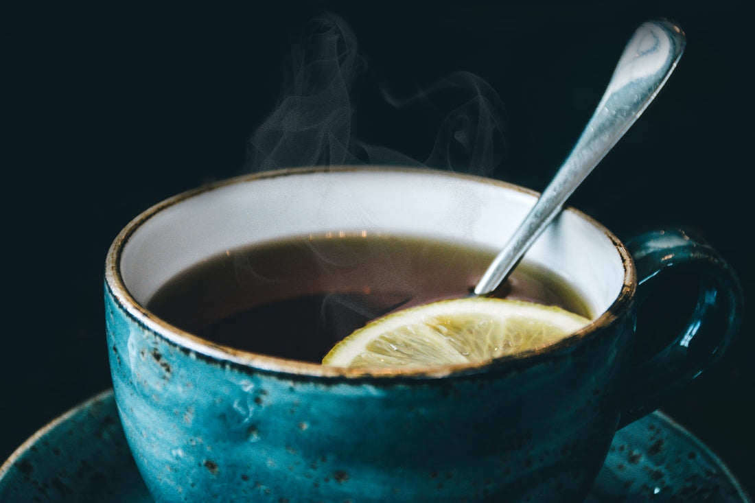 Blue tea cup with spoon and lemon