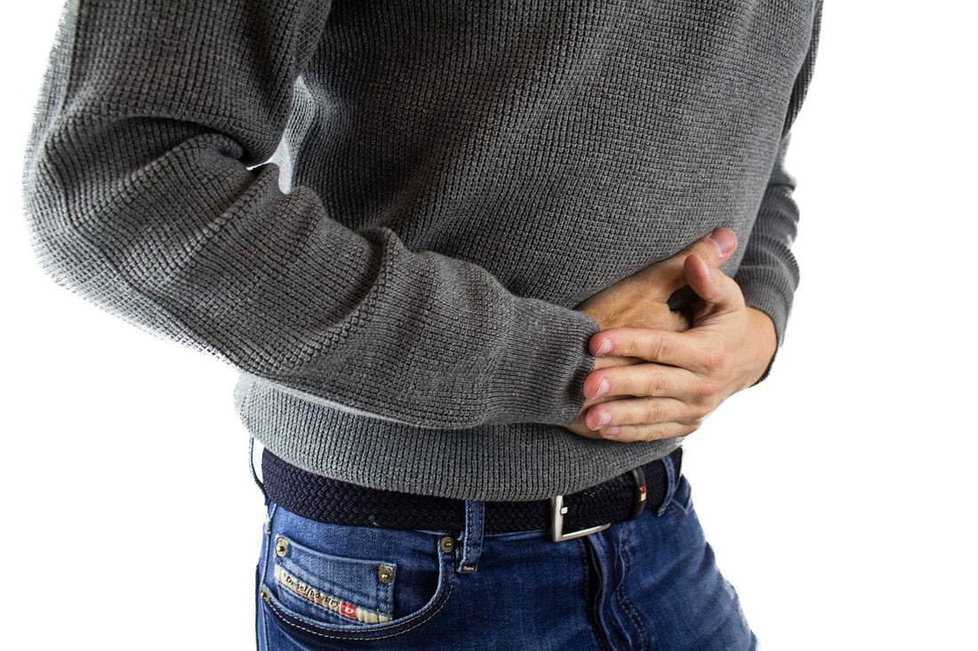 Man holding his stomach in pain