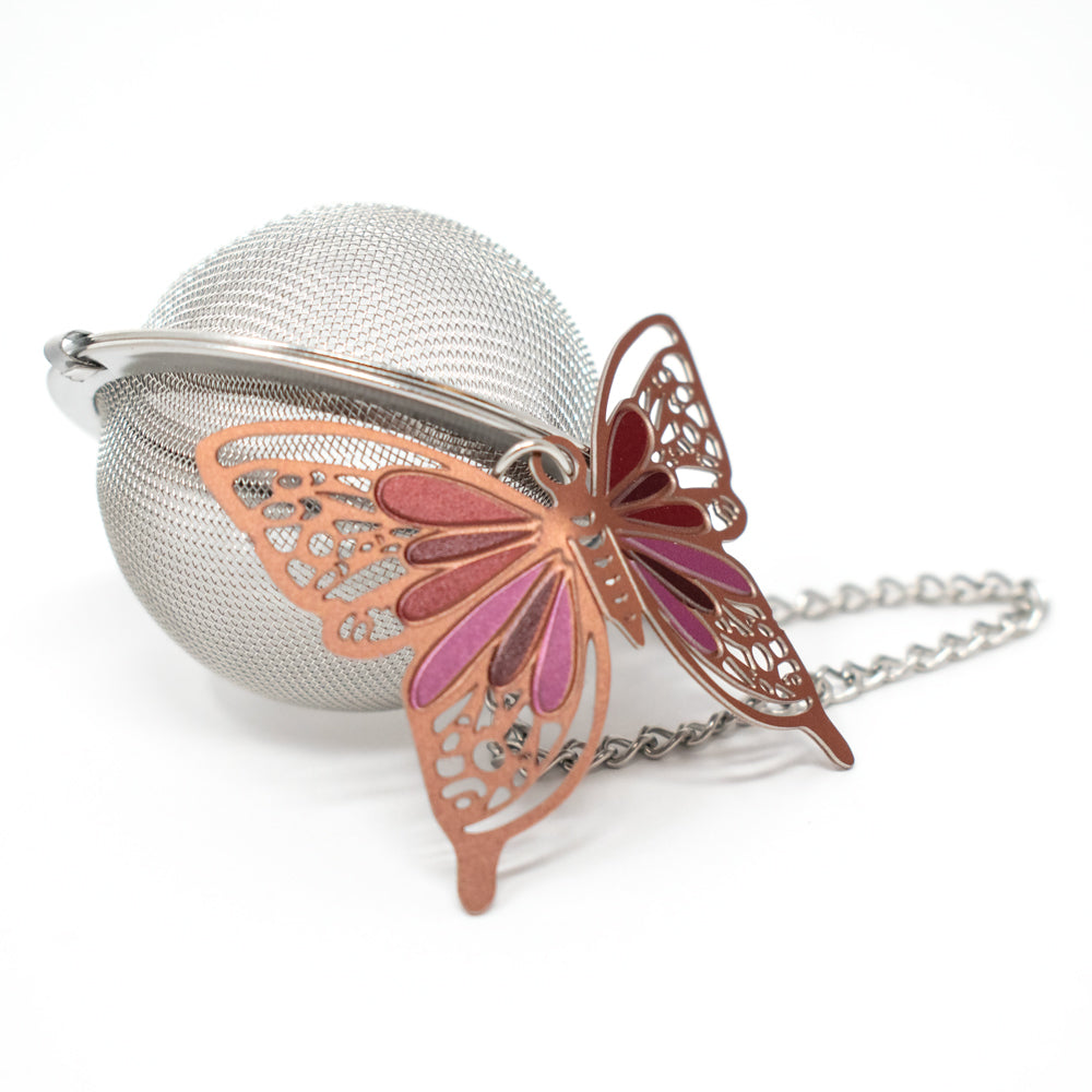 Tea ball with butterfly weight