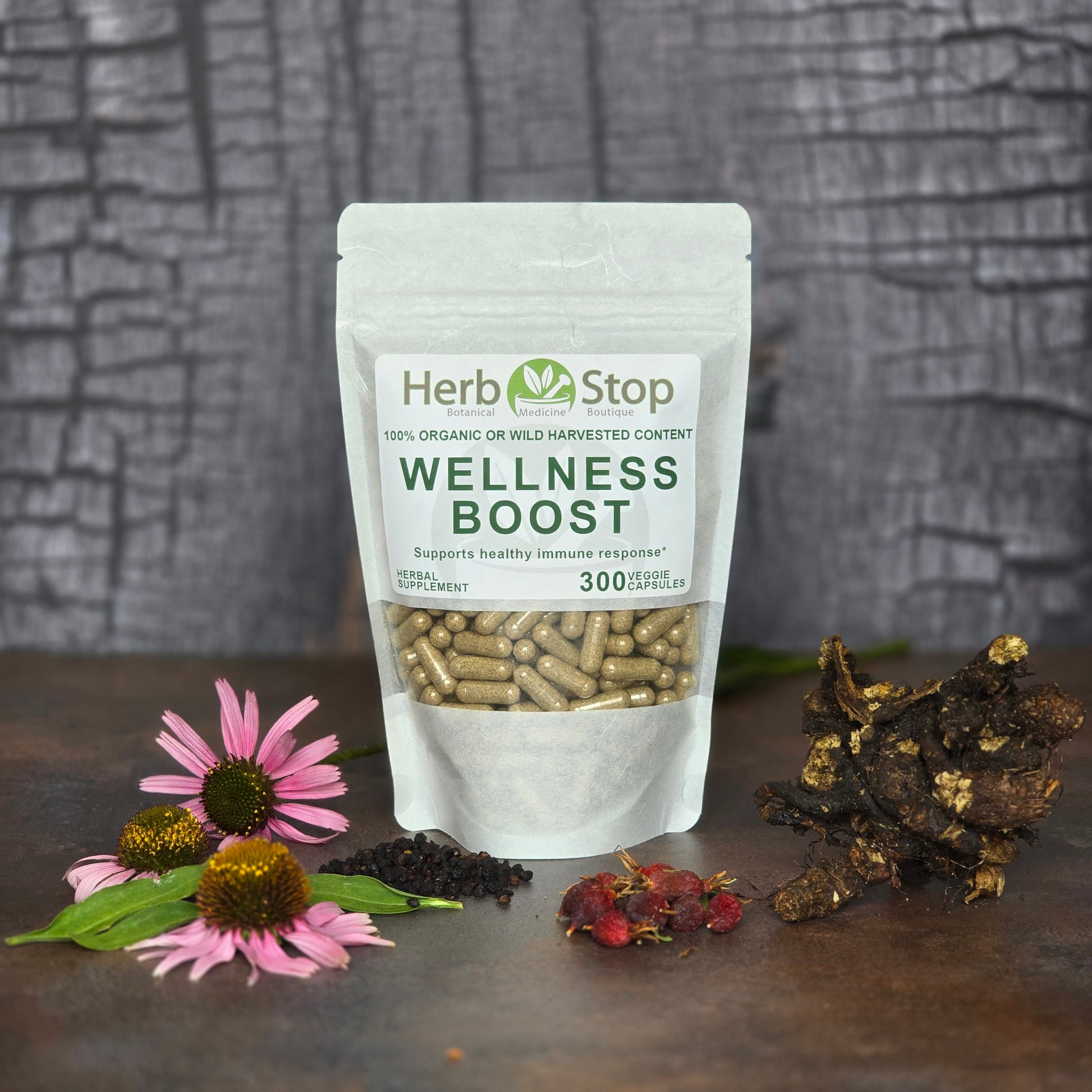 Wellness Boost Capsules surrounded by fresh herbs